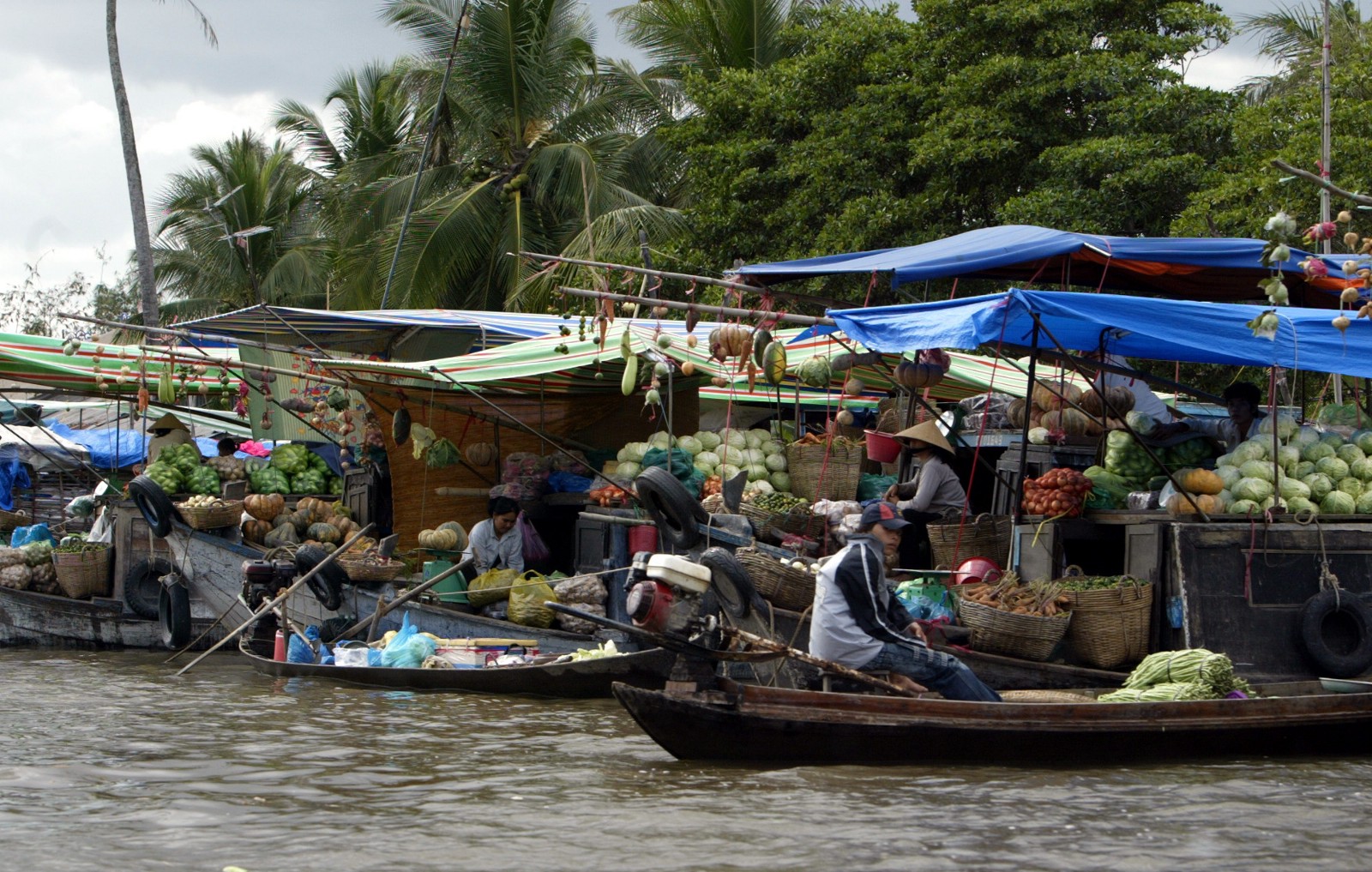 Boats loaded with fruits and vegetables on the Mekong river.